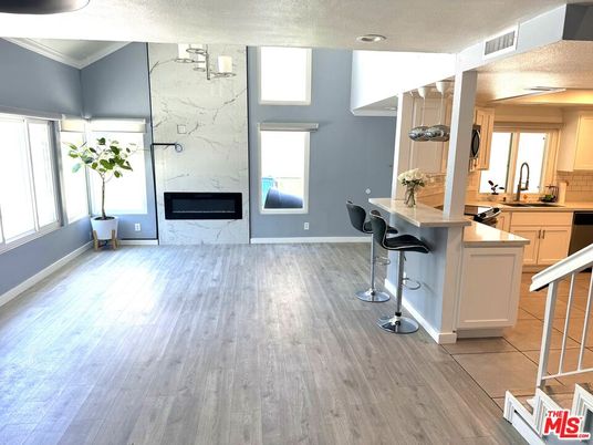 Fireplace, Interior, Kitchen, Marble Walls, Recessed Lighting, Wood Texture Flooring