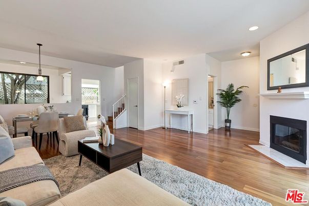 Dining room, Fireplace, Interior, Living room, Pendant Lights, Recessed Lighting, Wood Texture Flooring