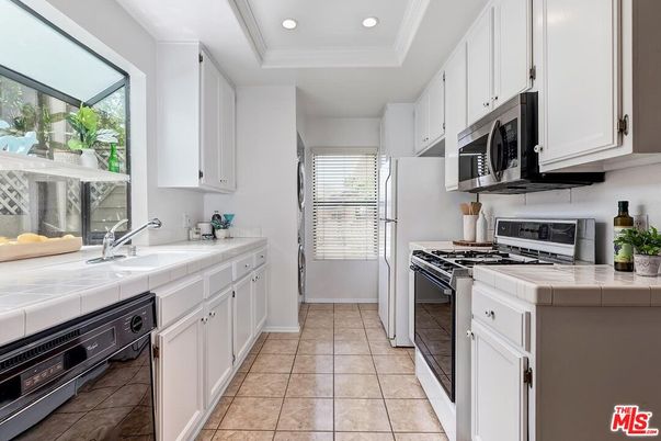 Interior, Kitchen, Recessed Lighting, Stainless Steel Appliances, Tile Countertops