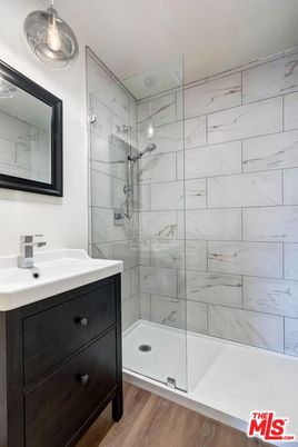Bathroom, Glass Shower, Interior, Marble Walls, Wood Texture Flooring