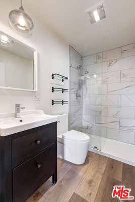 Bathroom, Glass Shower, Interior, Marble Walls, Wood Texture Flooring