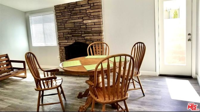 Dining room, Fireplace, Interior, Stone Walls, Wood Texture Flooring