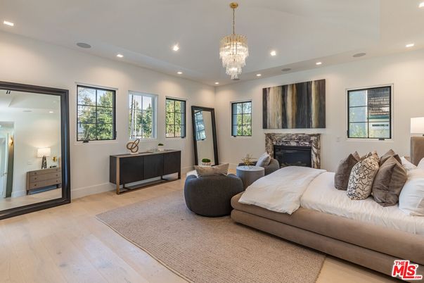 Bedroom, Chandelier, Fireplace, Interior, Recessed Lighting, Wood Texture Flooring
