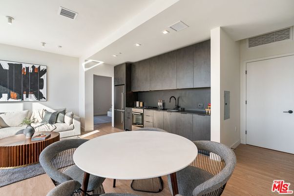 Dining room, Interior, Kitchen, Living room, Recessed Lighting, Stainless Steel Appliances, Wood Texture Flooring