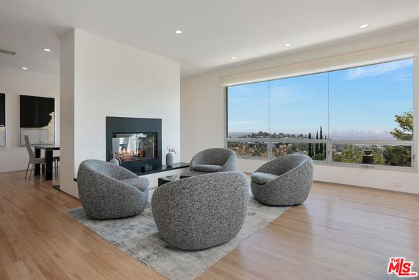 Dining room, Fireplace, Interior, Living room, Recessed Lighting, Wood Texture Flooring