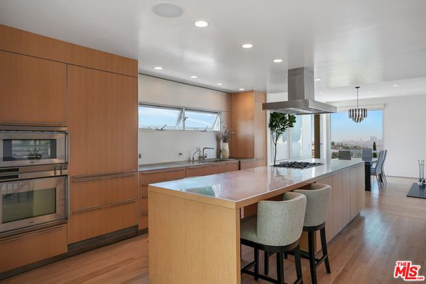 Chandelier, Dining room, Interior, Kitchen, Pendant Lights, Recessed Lighting, Stainless Steel Appliances, Wood Texture Flooring
