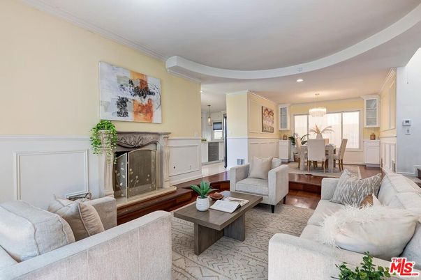 Chandelier, Dining room, Fireplace, Interior, Living room, Pendant Lights, Recessed Lighting, Wood Texture Flooring