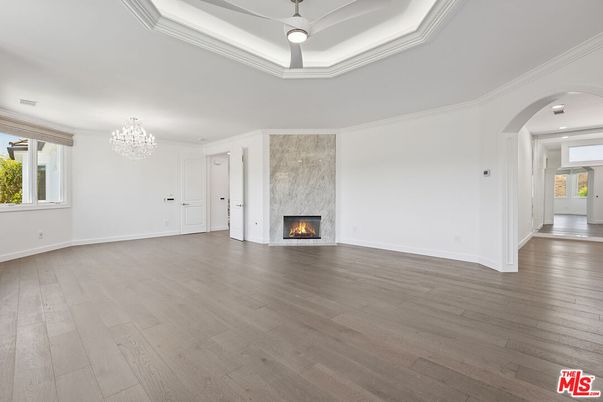 Chandelier, Empty room, Fireplace, Interior, Recessed Lighting, Wood Texture Flooring