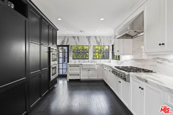 Interior, Kitchen, Marble Walls, Recessed Lighting, Stainless Steel Appliances, Wood Texture Flooring