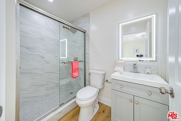 Bathroom, Glass Shower, Interior, Marble Walls, Recessed Lighting, Wood Texture Flooring