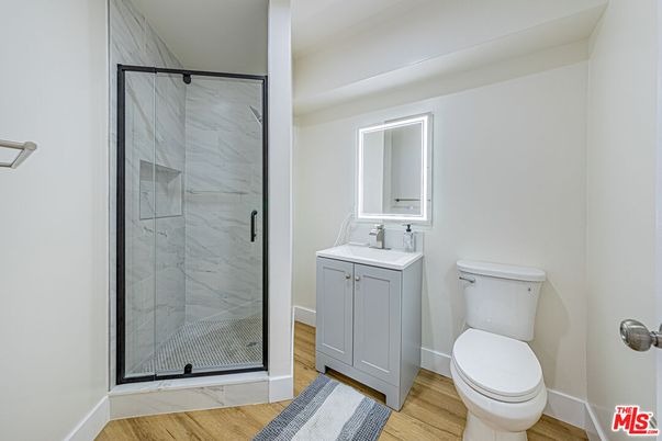 Bathroom, Glass Shower, Interior, Marble Walls, Wood Texture Flooring
