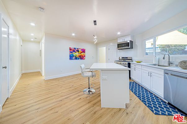Interior, Kitchen, Pendant Lights, Recessed Lighting, Stainless Steel Appliances, Wood Texture Flooring