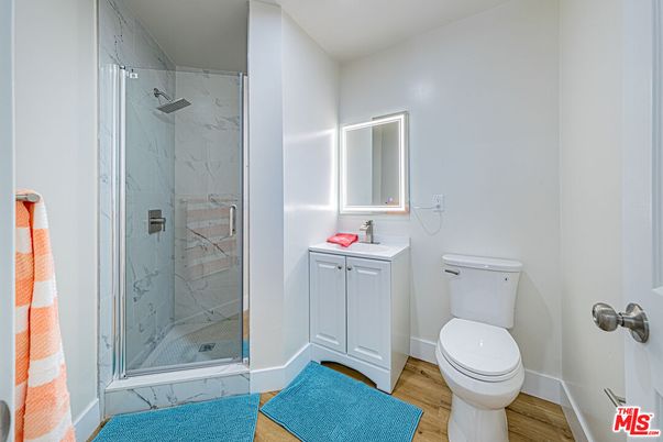 Bathroom, Glass Shower, Interior, Marble Walls, Wood Texture Flooring