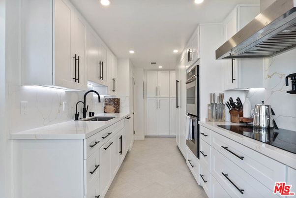 Interior, Kitchen, Marble Walls, Recessed Lighting, Stainless Steel Appliances