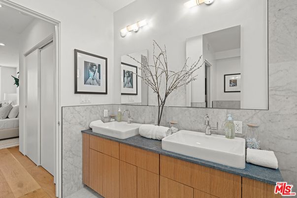 Bathroom, Dual Sink Vanities, Interior, Marble Walls, Wood Texture Flooring