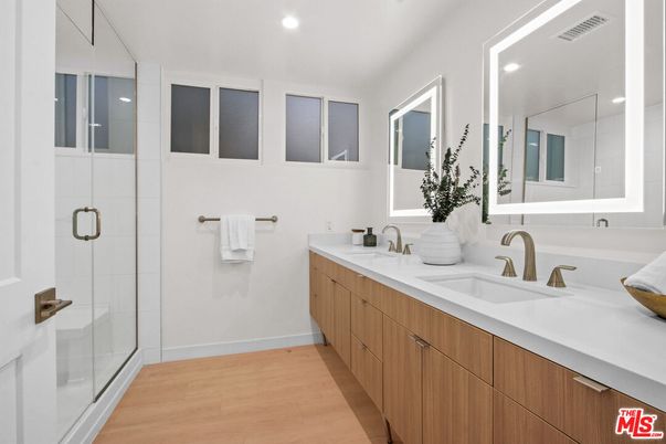 Bathroom, Dual Sink Vanities, Glass Shower, Interior, Recessed Lighting, Wood Texture Flooring