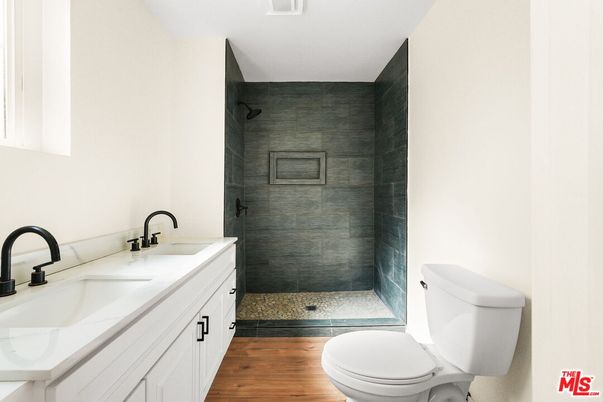 Bathroom, Dual Sink Vanities, Glass Shower, Interior, Wood Texture Flooring