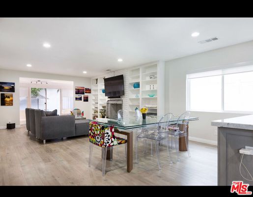 Dining room, Fireplace, Interior, Living room, Recessed Lighting, Wood Texture Flooring