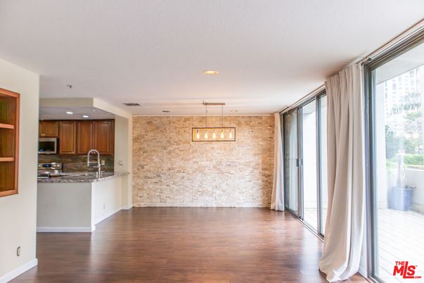 Interior, Kitchen, Pendant Lights, Recessed Lighting, Stainless Steel Appliances, Stone Walls, Wood Texture Flooring