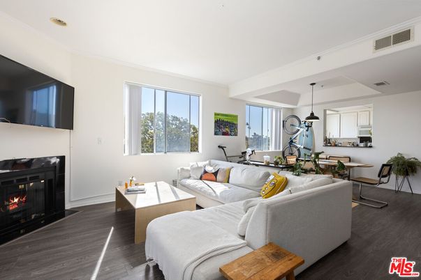 Dining room, Fireplace, Interior, Living room, Pendant Lights, Recessed Lighting, Wood Texture Flooring