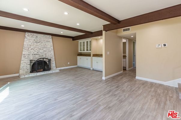 Empty room, Fireplace, Interior, Recessed Lighting, Wooden Beams, Wood Texture Flooring