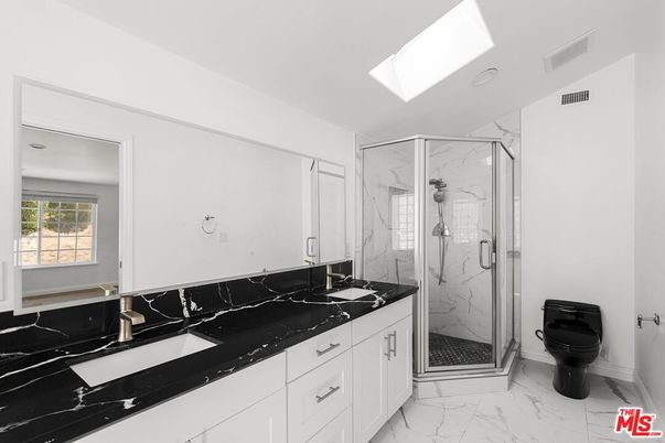 Bathroom, Dual Sink Vanities, Glass Shower, Interior, Marble, Marble Walls, Recessed Lighting