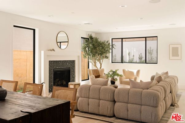 Dining room, Fireplace, Interior, Living room, Recessed Lighting, Wood Texture Flooring