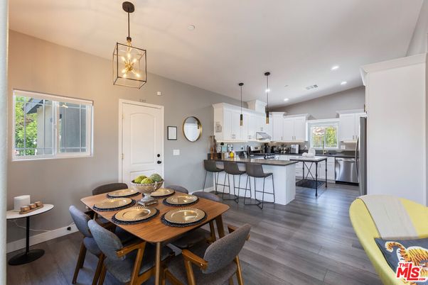 Dining room, Interior, Kitchen, Pendant Lights, Recessed Lighting, Stainless Steel Appliances, Wood Texture Flooring