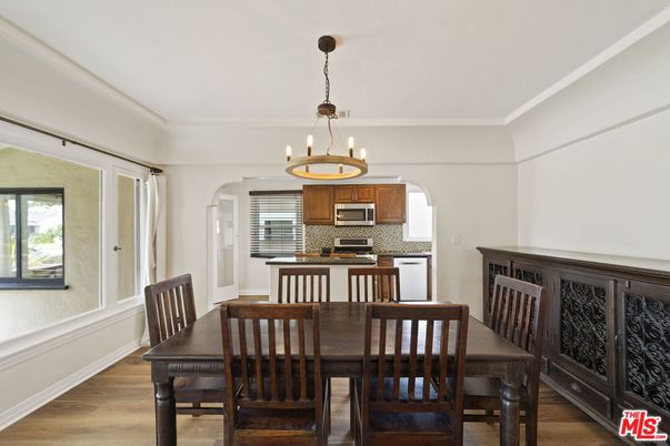 Chandelier, Dining room, Interior, Kitchen, Pendant Lights, Stainless Steel Appliances, Wood Texture Flooring