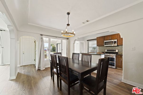 Chandelier, Dining room, Interior, Kitchen, Pendant Lights, Stainless Steel Appliances, Wood Texture Flooring