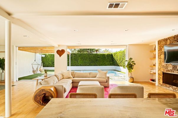 Fireplace, Interior, Living room, Recessed Lighting, Stone Walls, Wood Texture Flooring