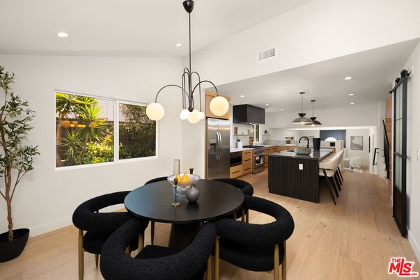 Dining room, Interior, Kitchen, Pendant Lights, Recessed Lighting, Stainless Steel Appliances, Wood Texture Flooring