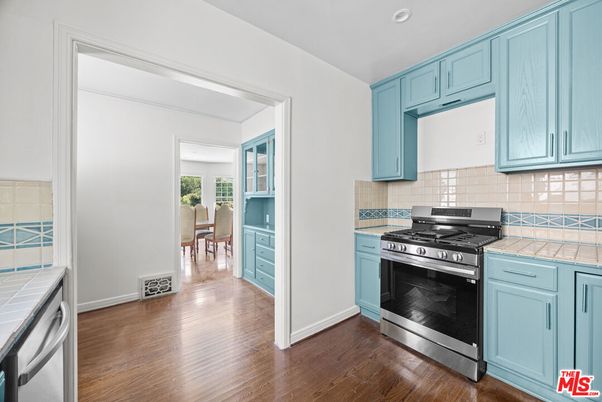 Interior, Kitchen, Recessed Lighting, Stainless Steel Appliances, Tile Countertops, Wood Texture Flooring