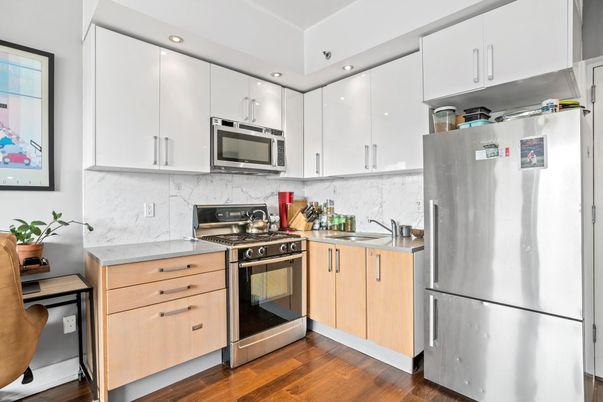 Interior, Kitchen, Marble Walls, Recessed Lighting, Stainless Steel Appliances, Wood Texture Flooring