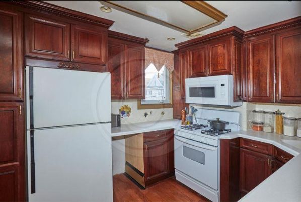 Interior, Kitchen, Recessed Lighting, Tile Countertops, Wood Texture Flooring