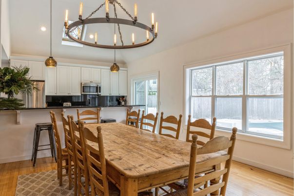 Chandelier, Dining room, Interior, Kitchen, Pendant Lights, Recessed Lighting, Stainless Steel Appliances, Wood Texture Flooring