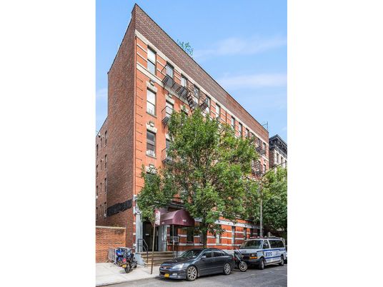 Exterior, Facade, Brick Facade, Condo Building