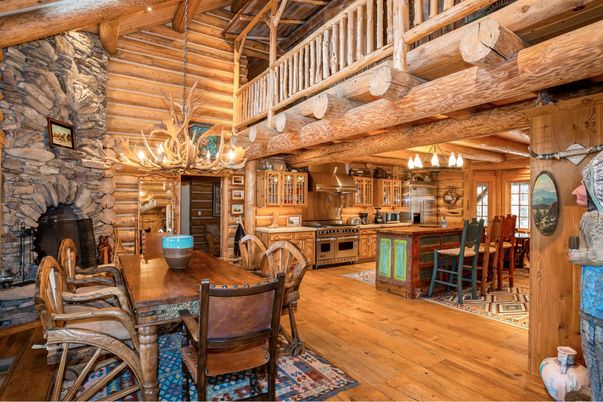 Chandelier, Dining room, Fireplace, Interior, Kitchen, Stainless Steel Appliances, Stone Walls, Wooden Beams, Wooden Ceilings, Wood Texture Flooring, Wooden Walls