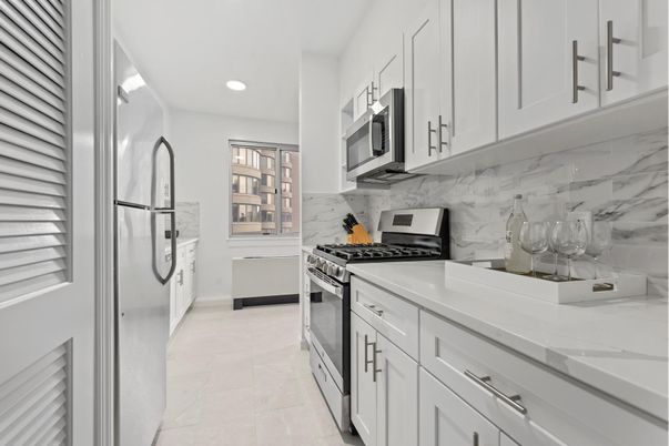 Interior, Kitchen, Marble Walls, Recessed Lighting, Stainless Steel Appliances