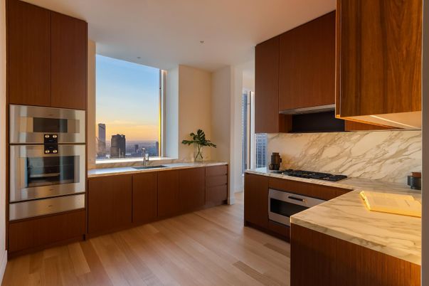 Interior, Kitchen, Marble Walls, Recessed Lighting, Stainless Steel Appliances, Wood Texture Flooring