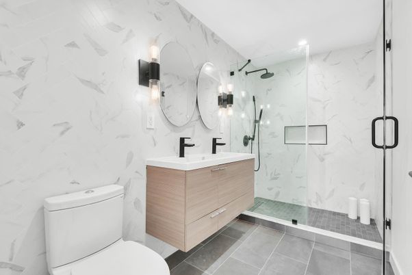 Bathroom, Dual Sink Vanities, Glass Shower, Interior, Marble Walls, Recessed Lighting