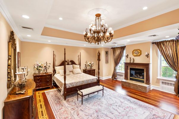 Bedroom, Chandelier, Fireplace, Interior, Recessed Lighting, Wood Texture Flooring