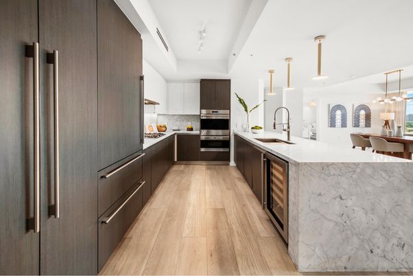 Interior, Kitchen, Marble Walls, Pendant Lights, Recessed Lighting, Stainless Steel Appliances, Wood Texture Flooring