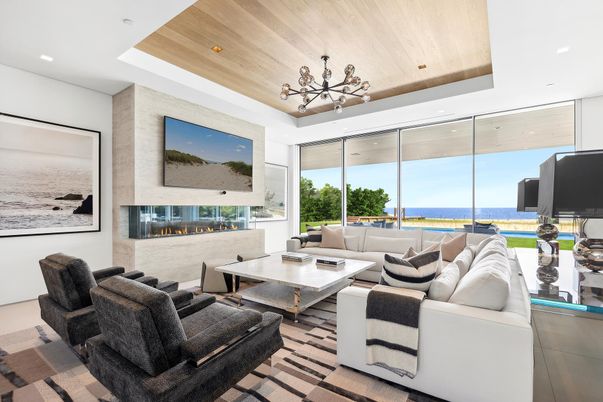 Fireplace, Interior, Living room, Recessed Lighting, Water, Wooden Ceilings