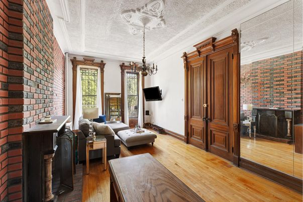 Chandelier, Fireplace, Interior, Living room, Stone Walls, Wood Texture Flooring