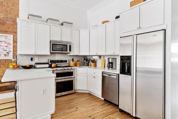Interior, Kitchen, Pendant Lights, Stainless Steel Appliances, Stone Walls, Wood Texture Flooring