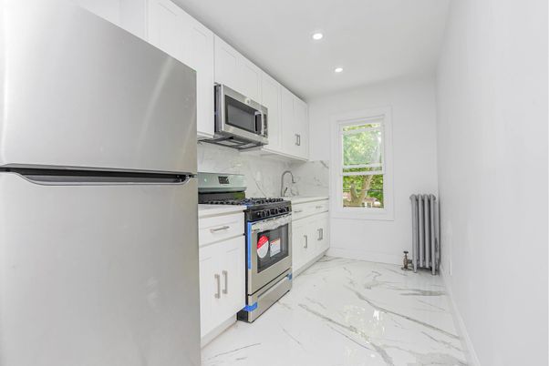 Interior, Kitchen, Marble, Marble Walls, Recessed Lighting, Stainless Steel Appliances