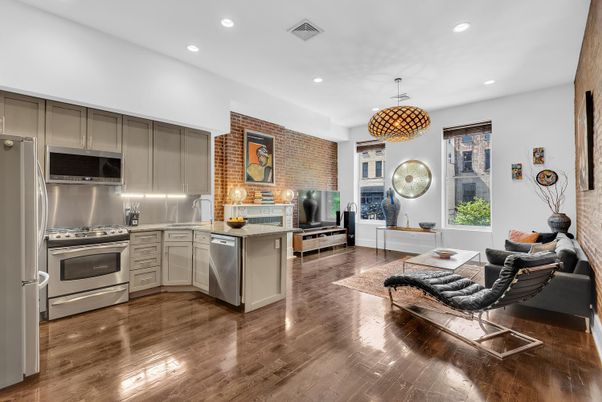 Fireplace, Interior, Kitchen, Living room, Pendant Lights, Recessed Lighting, Stainless Steel Appliances, Stone Walls, Wood Texture Flooring