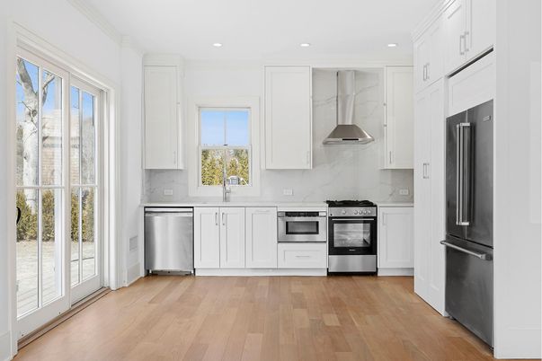 Interior, Kitchen, Marble Walls, Recessed Lighting, Stainless Steel Appliances, Wood Texture Flooring