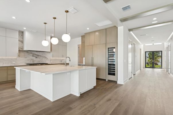 Interior, Kitchen, Marble Walls, Pendant Lights, Recessed Lighting, Stainless Steel Appliances, Wood Texture Flooring